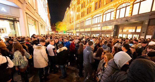 e crowd of young people has built up outside Harrods Knightsbridge London Great Britain 5t 1